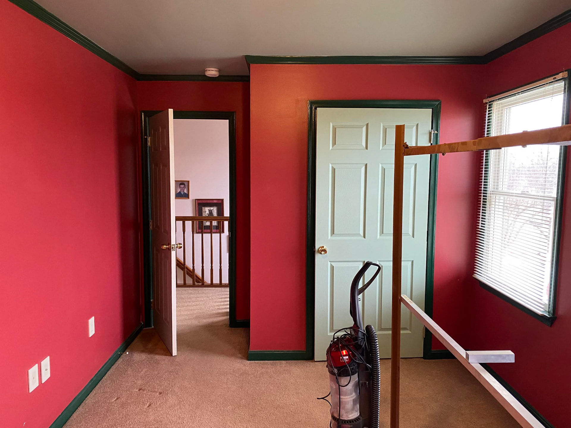 Bedroom repaint — bold red walls after 1